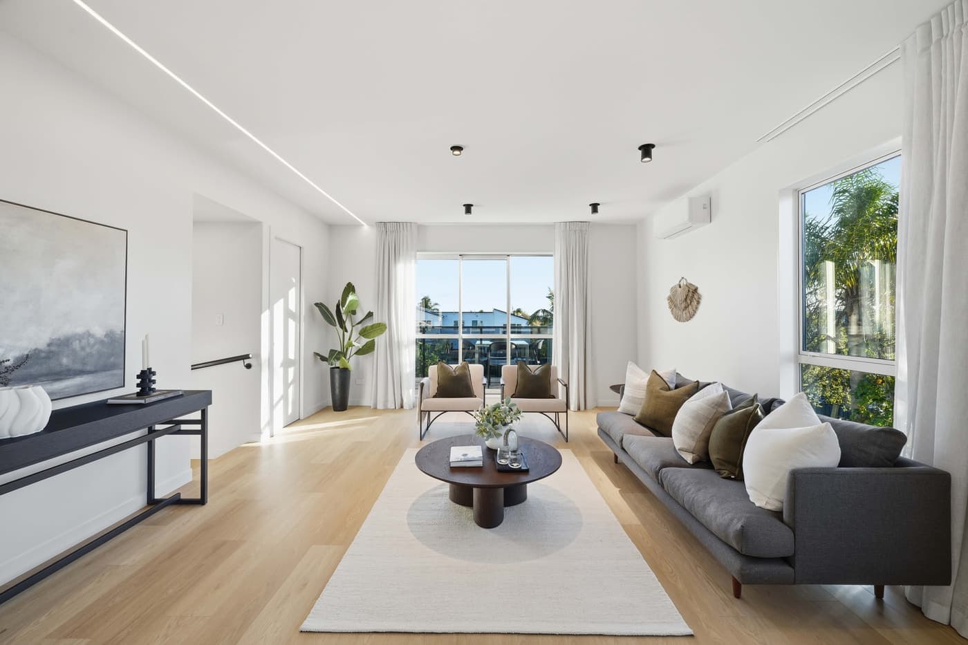 Living room opening to a harbour outlook