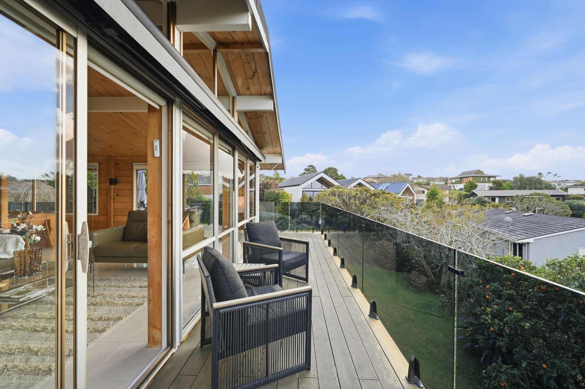Deck with glass balustrade and sea views