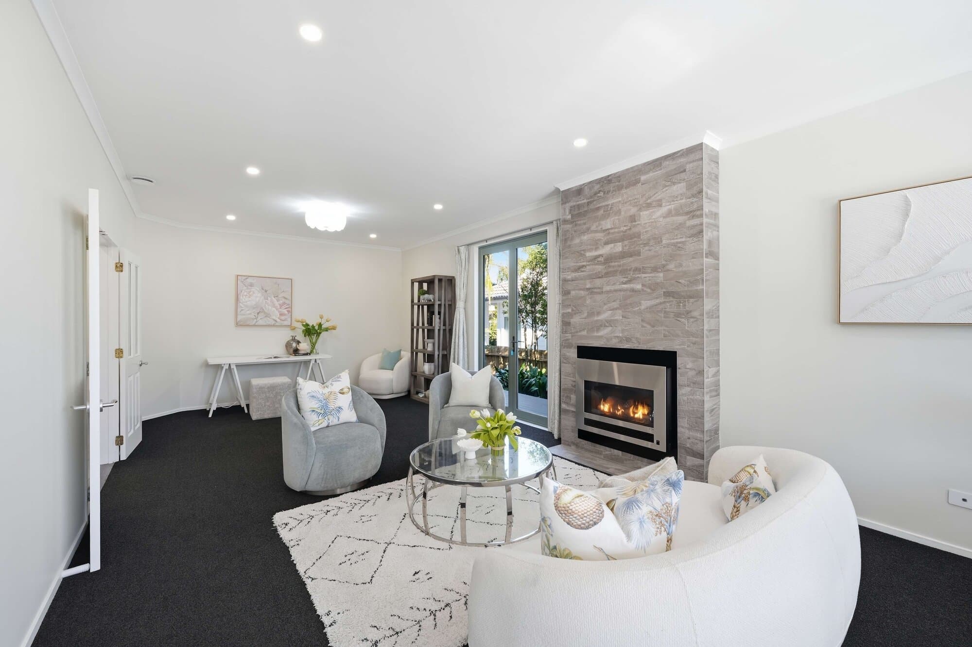Living room with a curved sofa and fireplace