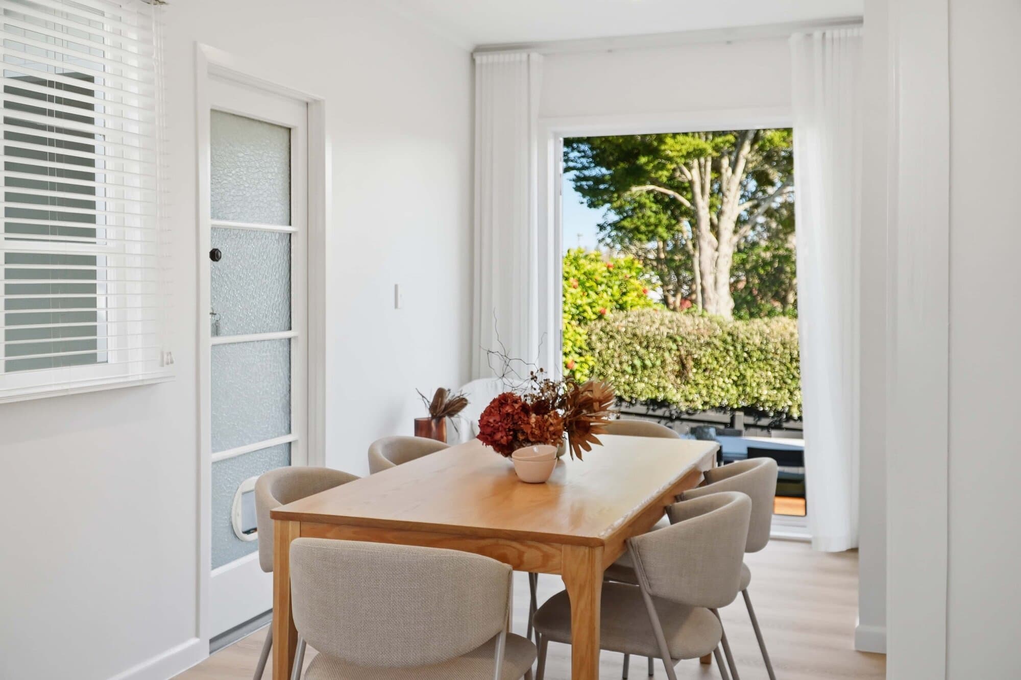French doors opening onto the garden from the dining area