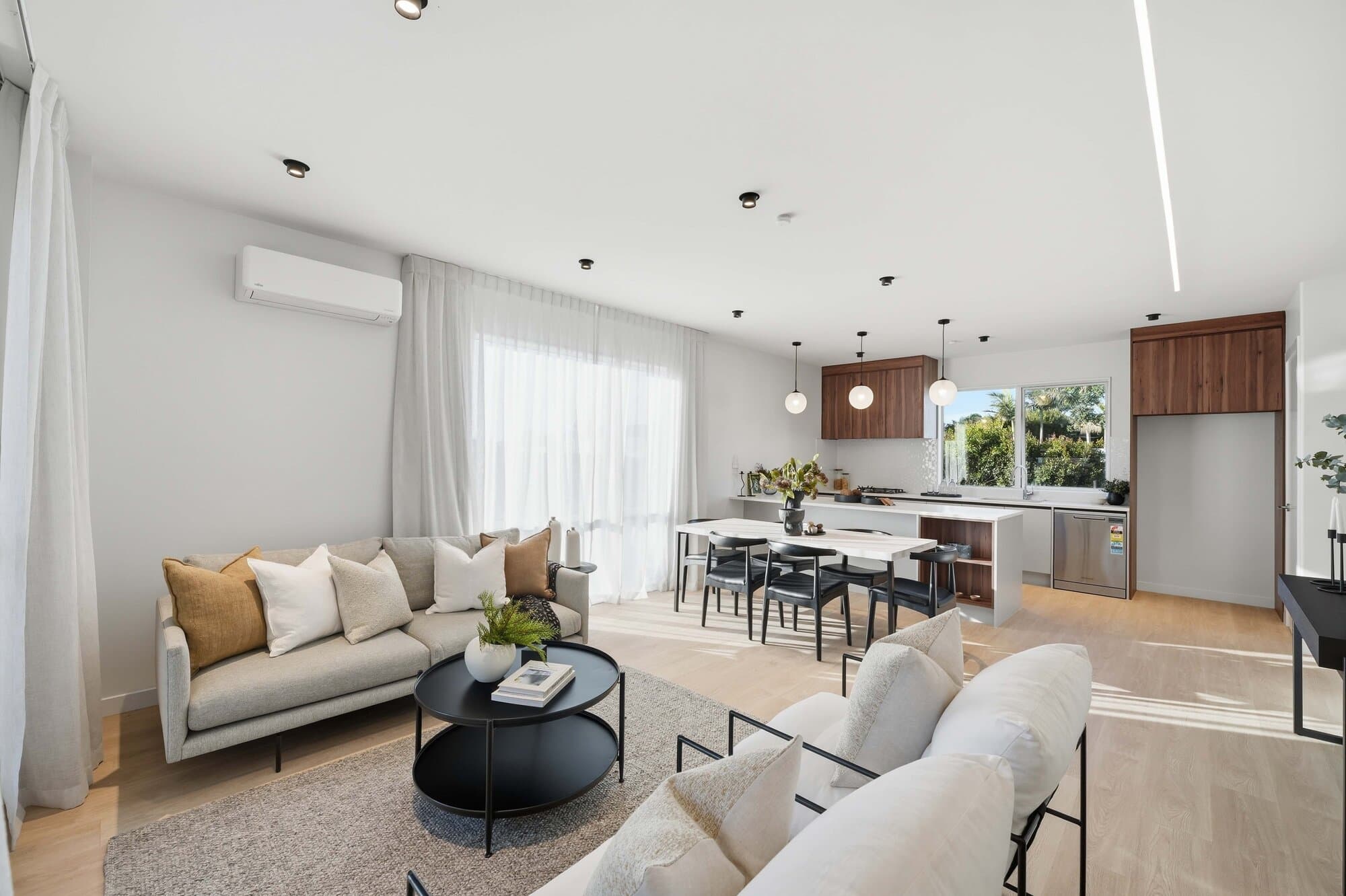 Wide angle of the combined living and kitchen space
