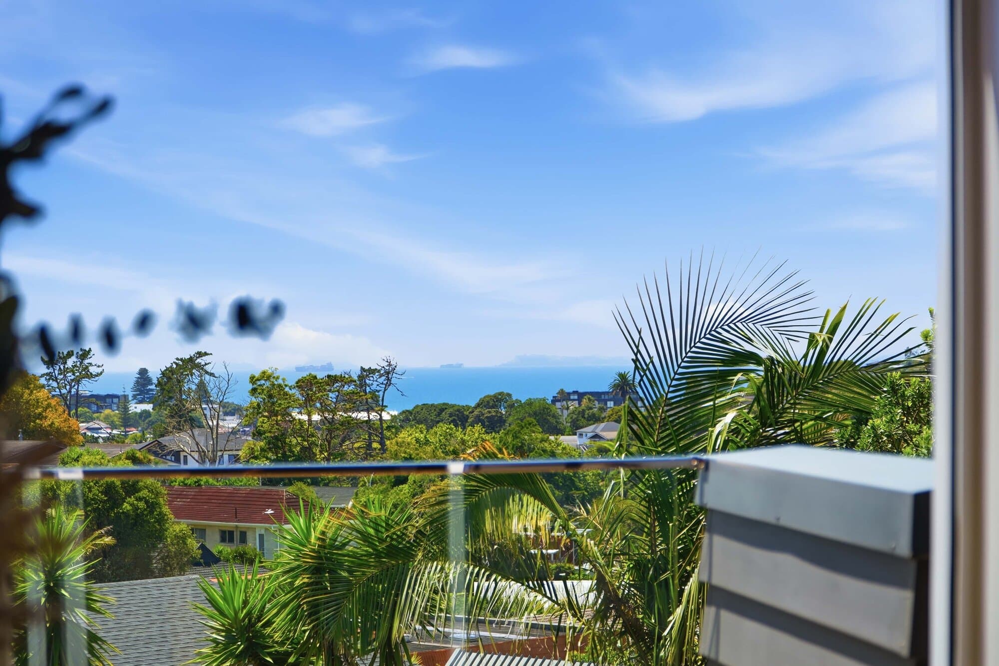 Deck with a sea view through the balcony glass