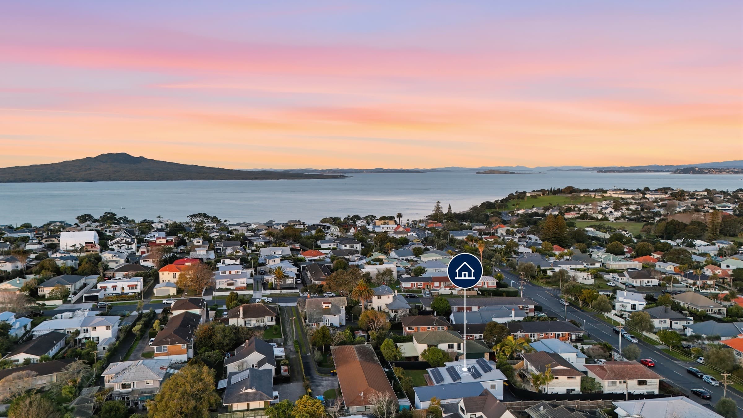 Aerial view over Narrow Neck at twilight, Rangitoto across the water